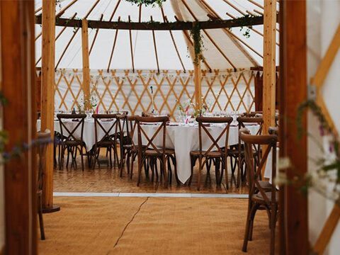 Wedding dining set up inside yurt