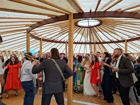 Wedding band playing inside a yurt