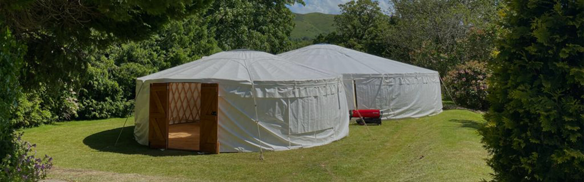 Two Yurts in an enclosed field